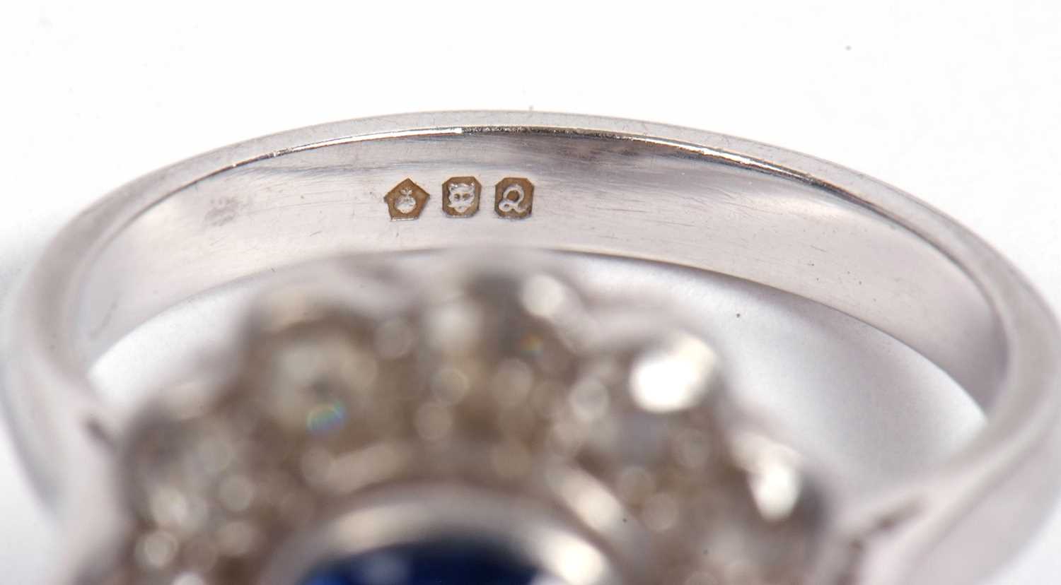 A sapphire and diamond cluster ring, the cushion shaped faceted sapphire is 7x7x4mm approx, bezel - Image 9 of 11