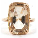 A citrine dress ring, the mixed cut citrine, approx. 16 x 11 x 8mm, in a four claw mount with