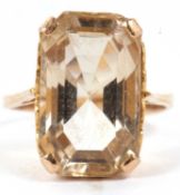 A citrine dress ring, the mixed cut citrine, approx. 16 x 11 x 8mm, in a four claw mount with