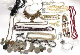 A mixed lot of costume jewellery to include bead necklaces, faux pearls, faux jet, brooches etc. and