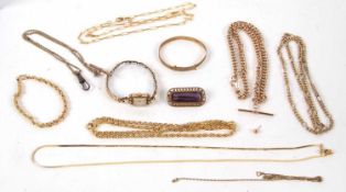 A mixed lot to include a faux amethyst brooch, gilt metal chains, a watch etc