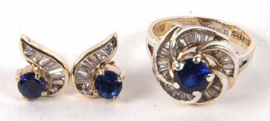 A silver gilt blue and white stone ring and matching earrings, the central round blue stone