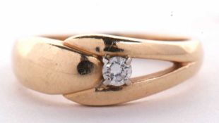 A 14k diamond ring, the round brilliant cut diamond set, with plain tapering band stamped 14k,