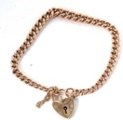 A 9ct rose gold bracelet, the curblink chain (each link with worn mark) and heart shape padlock