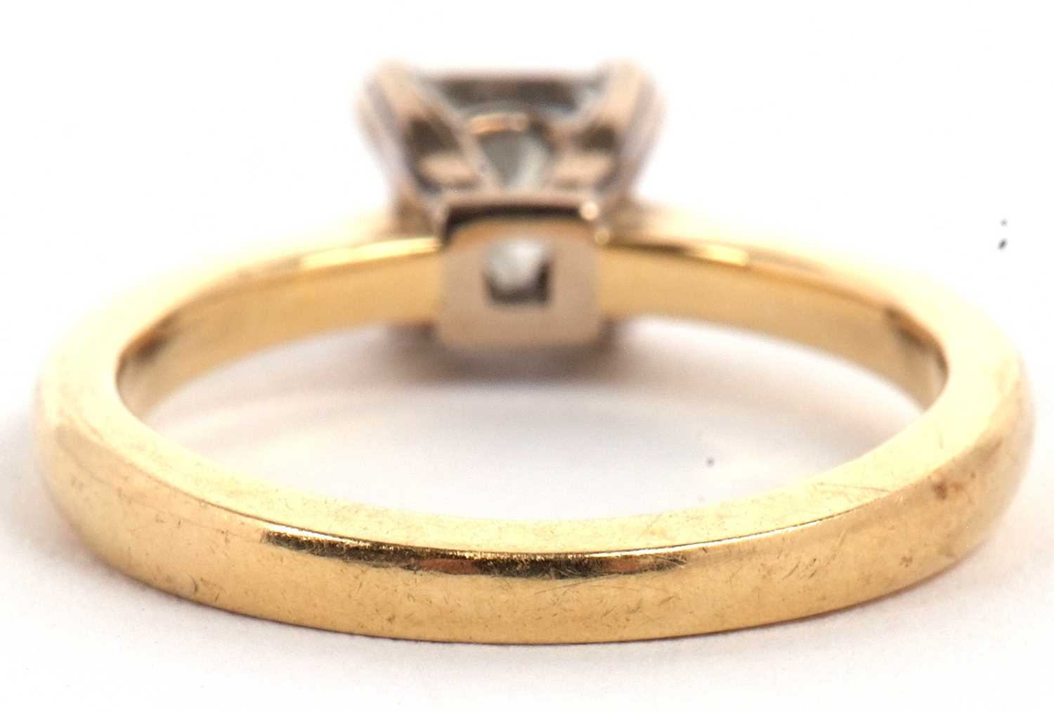 An 18ct princess cut diamond ring, wieght approx. 0.75cts, in a four claw mount to a plain band - Image 6 of 11