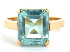 An 18ct aquamarine ring, the emerald cut aquamarine, approx. 10.8 x 9.4 x 6.3mm, in a four claw