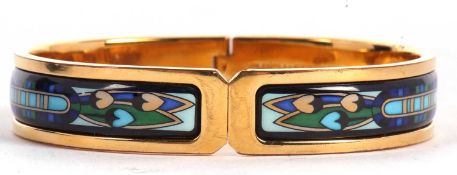 An enamel hinged bangle by Michaela Frey, the 12mm wide yellow metal bangle with Art Nouveau style