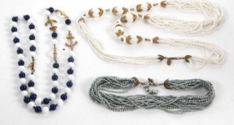 Three necklaces by Miriam Haskell, the first with blue and white glass beads with gilt metal