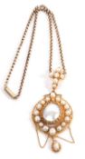 An early 20th century cultured pearl pendant, the central oval mabe pearl, collet and claw