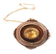 A Victorian citrine brooch, the oval brooch set to centre with an oval facted citrine, collet