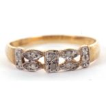 A 9ct diamond ring, the 4mm wide band set with small round diamonds, with tapered shoulders and