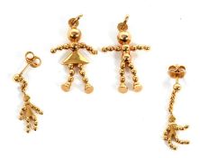 A matched suite of 9ct jewellery, to include a pair of gold bead boy and girl earrings, both stamped