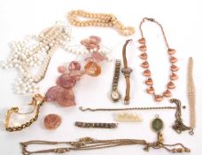 A mixed lot of jewellery to include a topaz pendant stamped 375, faux pearls, gilt chains, dyed
