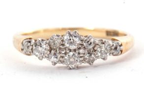 An 18ct diamond ring, set with old European cut diamonds, claw mounted in white metal to a plain