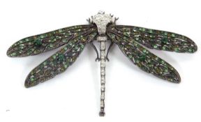 A dragonfly brooch by Kenneth Lane, the body set with white paste and the wings with varigated green