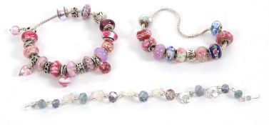 A quantity of costume jewellery to include a Pandora style bracelet, chain and glass beads stamped
