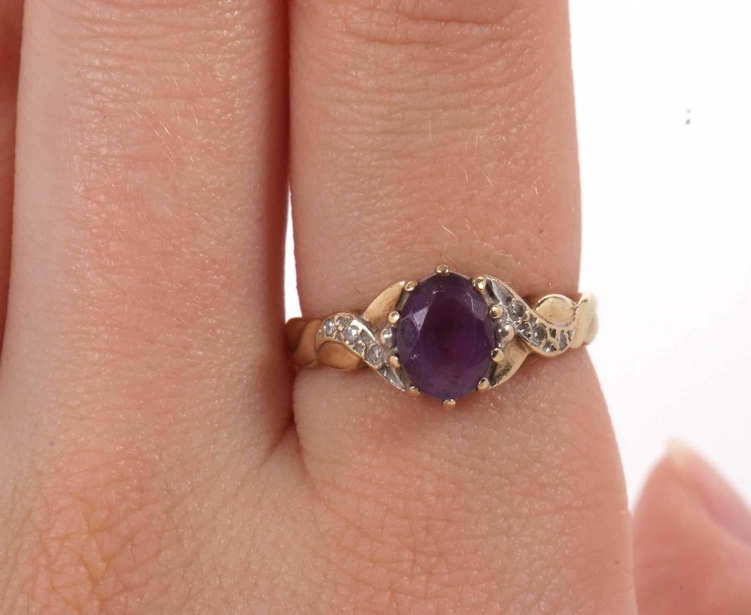 A 9ct amethyst and diamond ring, the oval amethyst with crossover style shoulders set with small - Image 8 of 8