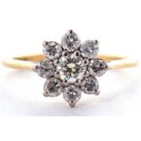 An 18ct diamond cluster ring, set with round brilliant cut diamonds, total estimated approx. 0.