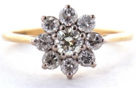 An 18ct diamond cluster ring, set with round brilliant cut diamonds, total estimated approx. 0.