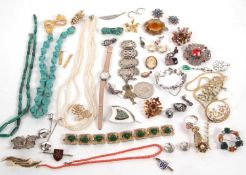 A quantity of costume jewellery to incude a Blue John brooch, a rice pearl necklace, malachite,