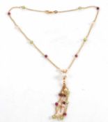An 18ct cultured pearl, peridot and garnet tassle necklace, the 18ct chain interspaced with