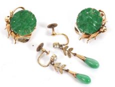 Two pairs of jade earrings, the first set with round, pierced discs of jade, approx. 16mm