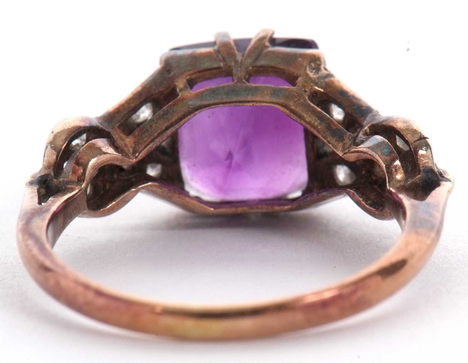 An amethyst and diamond ring, the modified square cut amethyst, claw mounted with crossover - Image 7 of 8