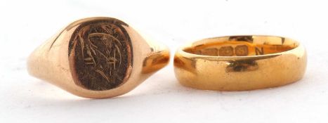 Two gold rings, to include a 22ct wedding band, Birmingham 1917, size M, 6.9g and a gold signet