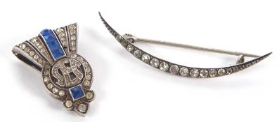 Two 20th century brooches, the first a continental silver crescent moon shape brooch set with