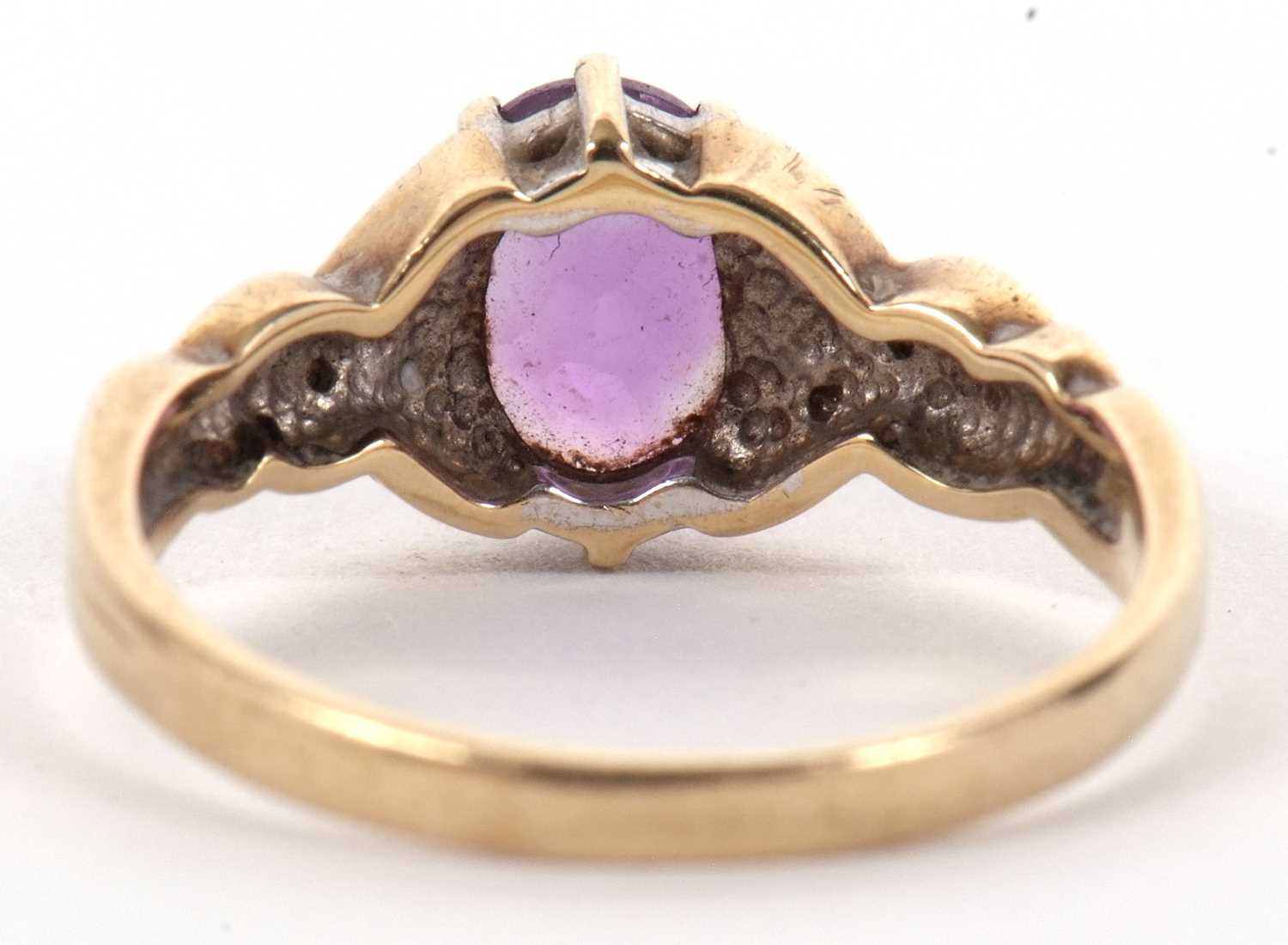 A 9ct amethyst and diamond ring, the oval amethyst with crossover style shoulders set with small - Image 4 of 8