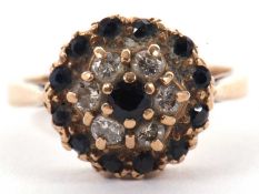 A 9ct sapphire and diamond cluster ring, set with a central small round sapphires surrounded by a