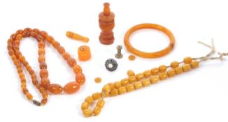 A quantity of faux amber, to include a graduated oval bead necklace, an off-round bead necklace, a