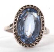 A synthetic blue spinel ring, the oval synthetic blue spinel, claw mounted with marcasite style