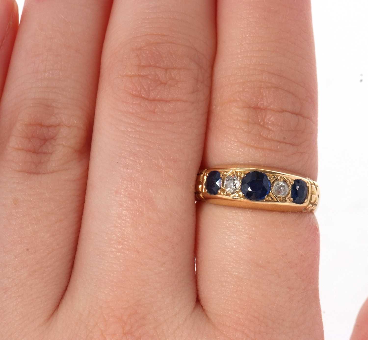 An Edwardian 18ct sapphire and diamond ring, the three graduated round sapphires interspaced with - Image 7 of 7