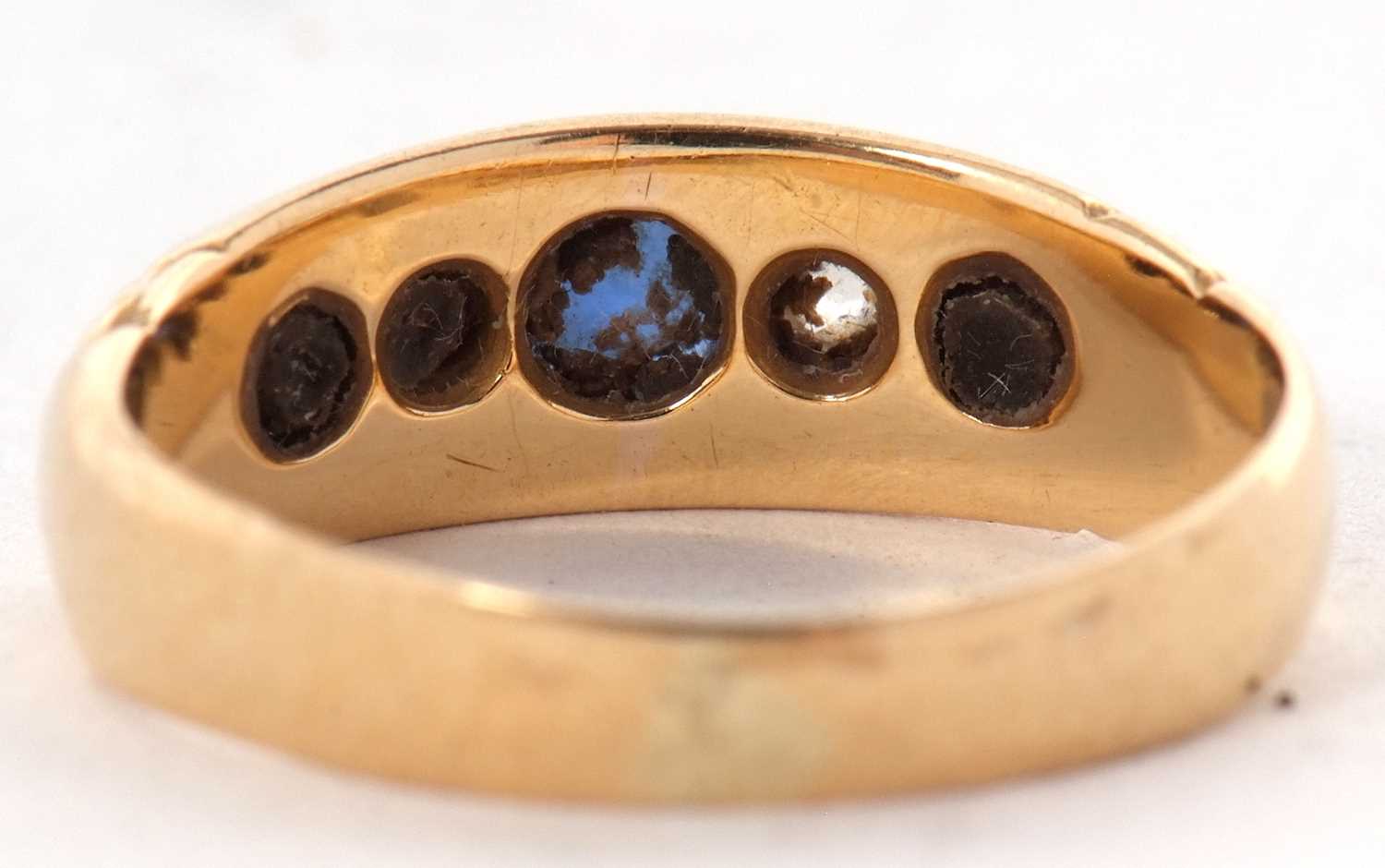 An Edwardian 18ct sapphire and diamond ring, the three graduated round sapphires interspaced with - Image 3 of 7