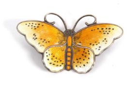 A Norweigan silver and enamel butterfly by Hroar Prydz, the front enamelled in white and yellow with