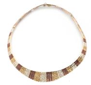 A tri-colour 9ct gold fringe necklace, with alternating sections of yellow, white and rose gold
