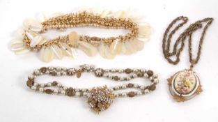 Three necklaces by Miriam Haskell, the first with a white paste and gilt metal flowerhead cluster