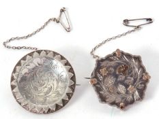 Two silver brooches, the first with bi-colour metal foliate decoration to front, 3cm diameter,