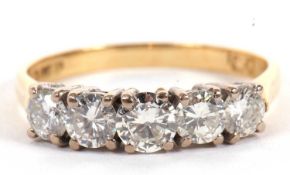 An 18ct five stone diamond ring, the five round brilliant cut diamonds, total estimated approx. 1.