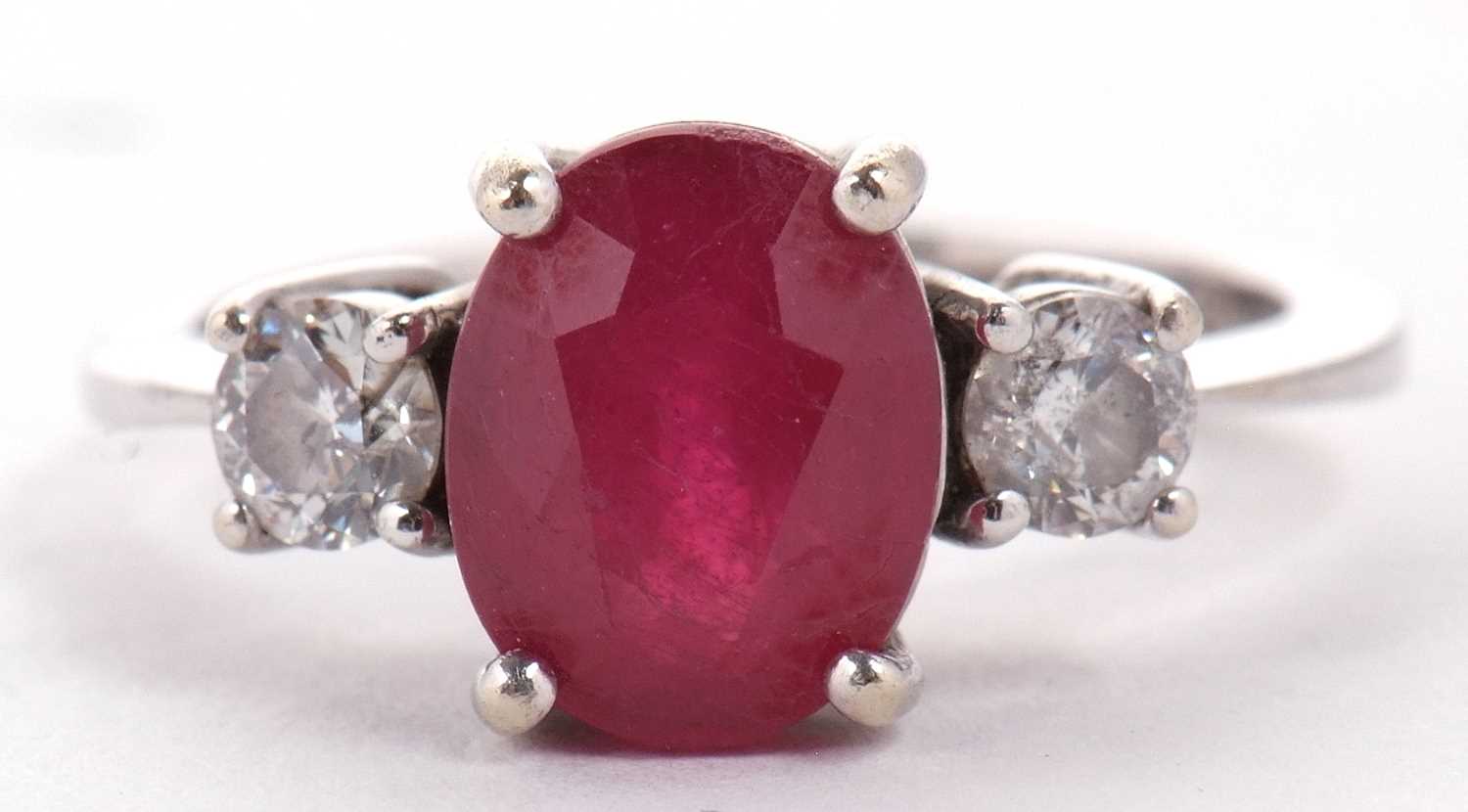 A 14ct white gold ruby and diamond ring, the oval mixed cut ruby, approx. 9.1 x 7.1 x 5.1mm, set - Image 2 of 10