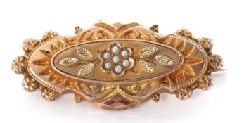 A seed pearl brooch, set to centre with a seed pearl flower within an oval palque with engraved leaf
