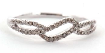 An 18ct white gold diamond ring, with a two strand diamond crossover band, tapered shoulders and