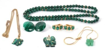 A group of malachite jewellery to include three elephant pendants, the first a malachite pendant set