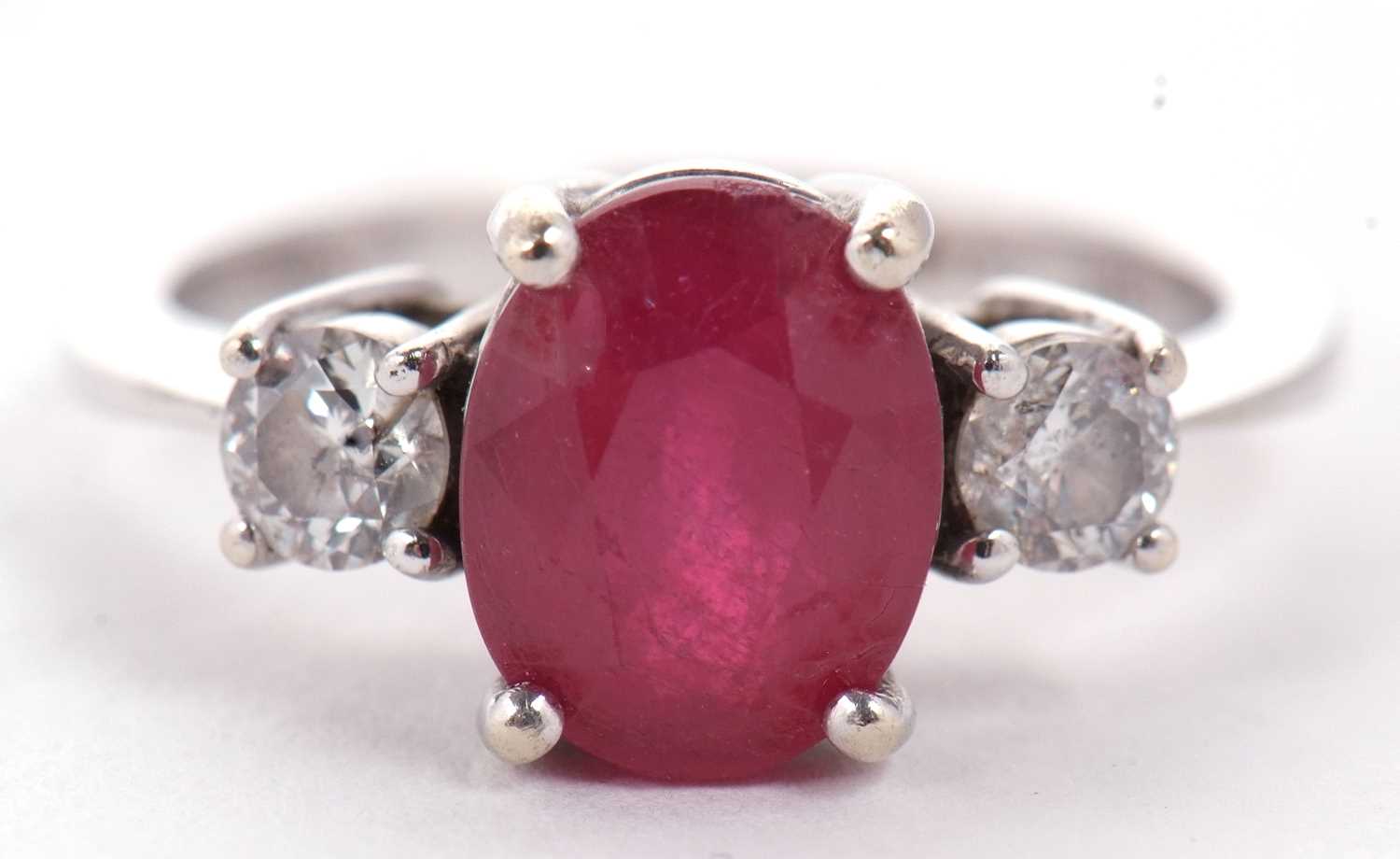 A 14ct white gold ruby and diamond ring, the oval mixed cut ruby, approx. 9.1 x 7.1 x 5.1mm, set - Image 3 of 10