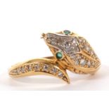 An 18ct snake head ring, the naturalistically modelled head pave set with diamonds and green