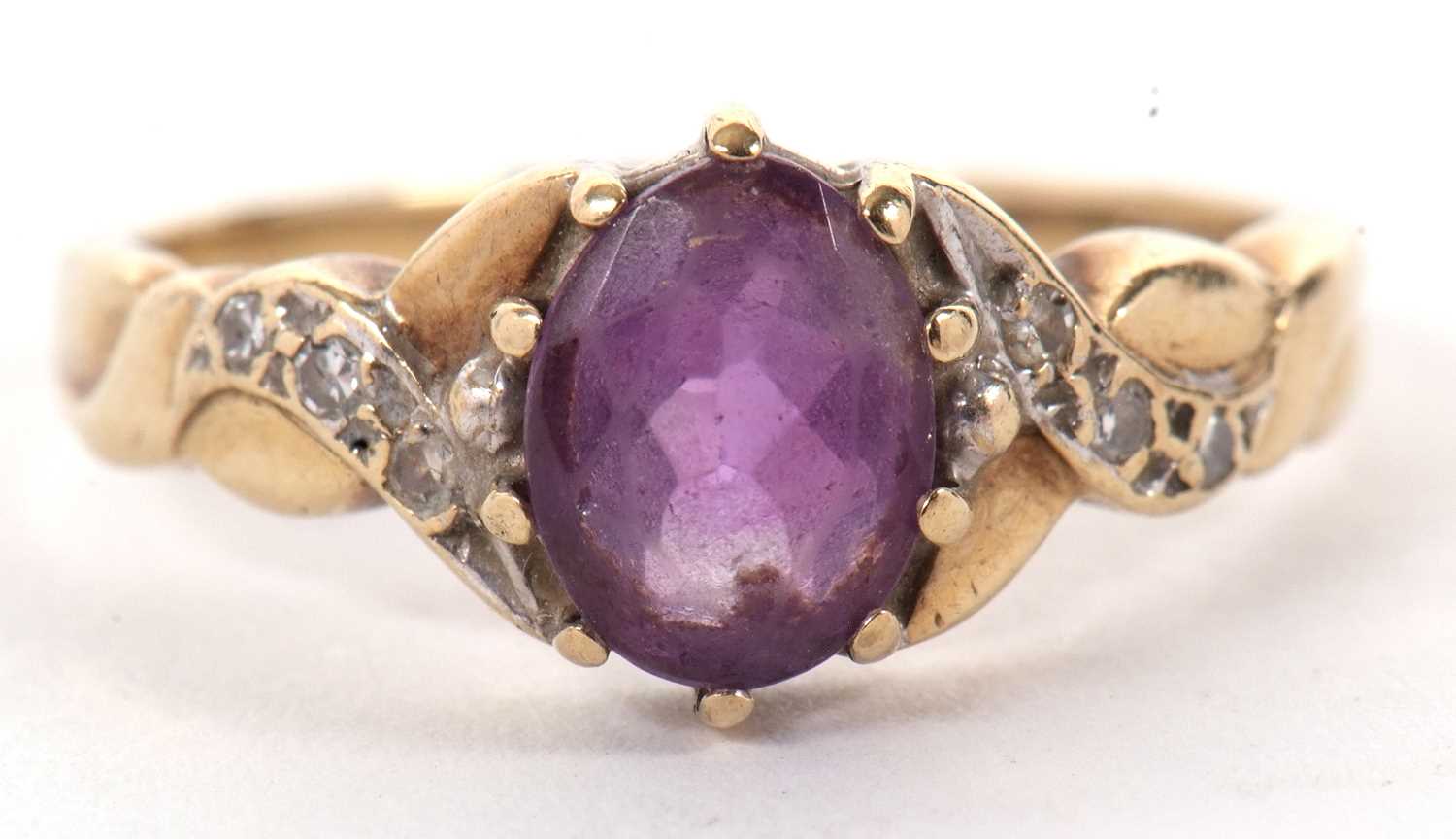 A 9ct amethyst and diamond ring, the oval amethyst with crossover style shoulders set with small - Image 2 of 8
