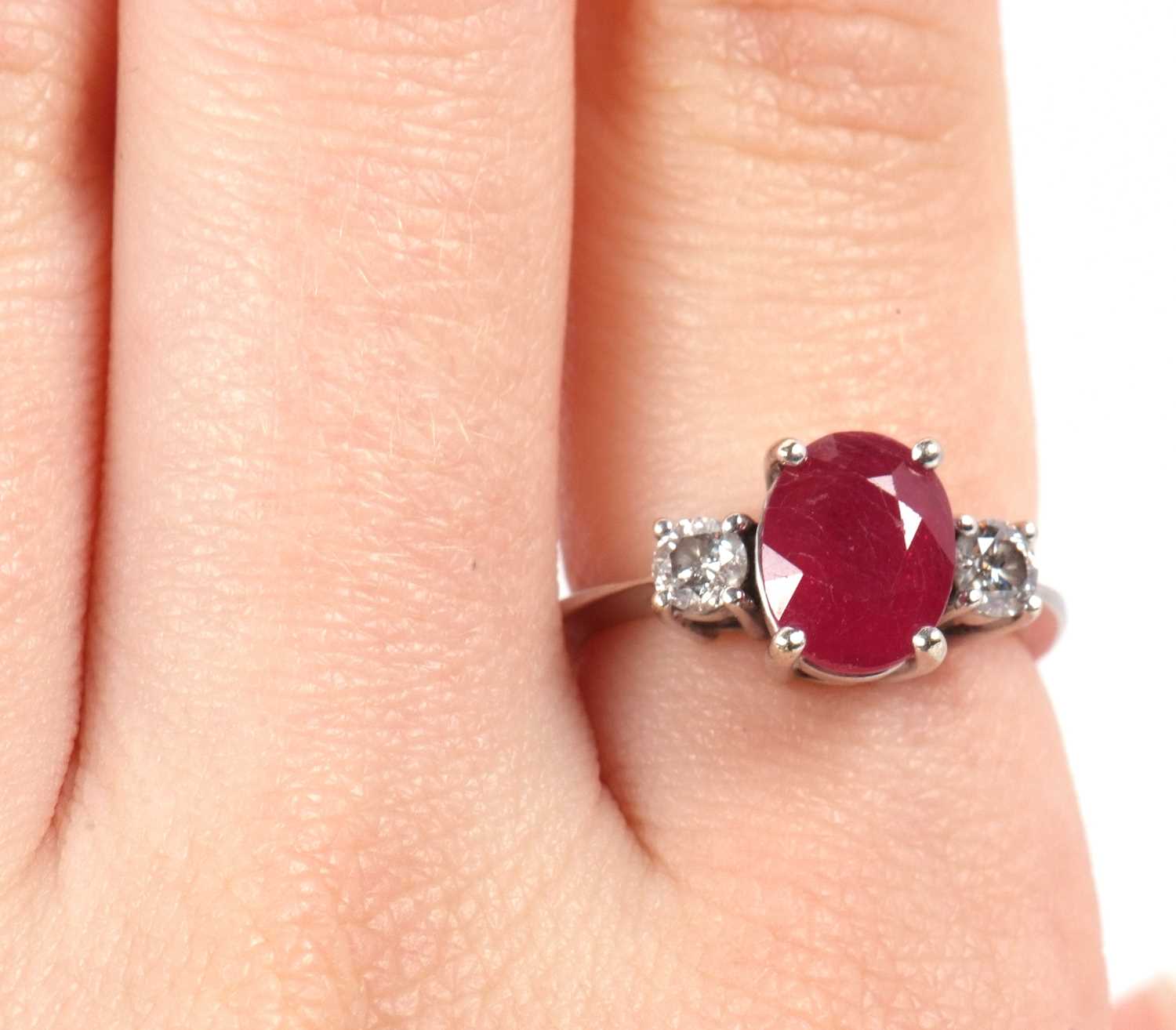 A 14ct white gold ruby and diamond ring, the oval mixed cut ruby, approx. 9.1 x 7.1 x 5.1mm, set - Image 10 of 10