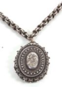 A silver locket and chain, the oval silver locket, approx. 4.7cm long, with Birmingham assay mark to