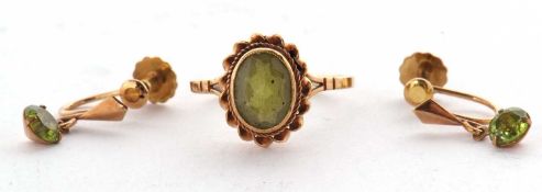 A 9ct peridot ring and pair of earrings, the ring set with an oval collet mounted peridot with